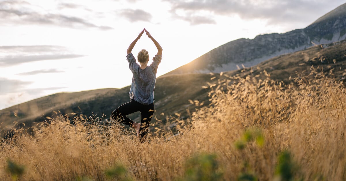 5 Sales Skills You Need to Master - Yoga on top of a mountain