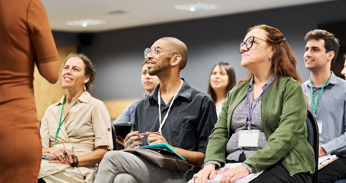 Salespeople attending a group sales training initiative